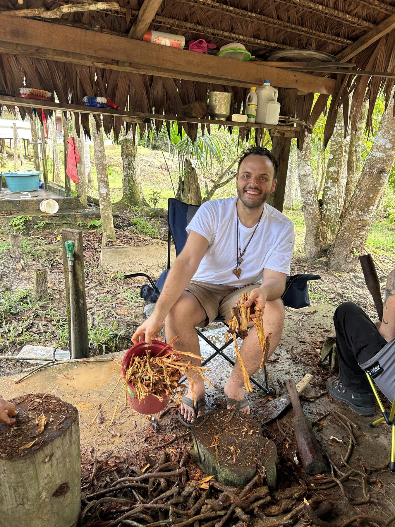 SANTOS working with plants during his training in the Peruvian Amazon